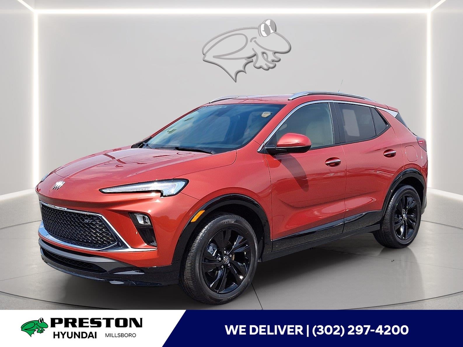 2024 Buick Encore GX Sport Touring in Sunrise Red Metallic — front three-quarter view
