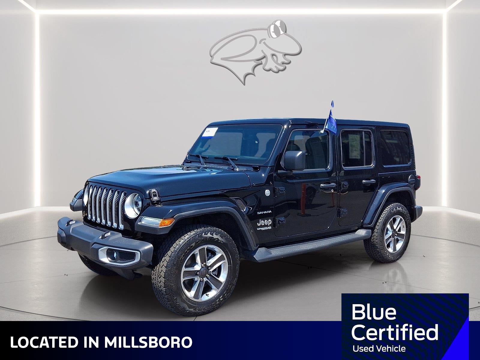 2021 Jeep Wrangler Unlimited Sahara in Black Clearcoat — front three-quarter view